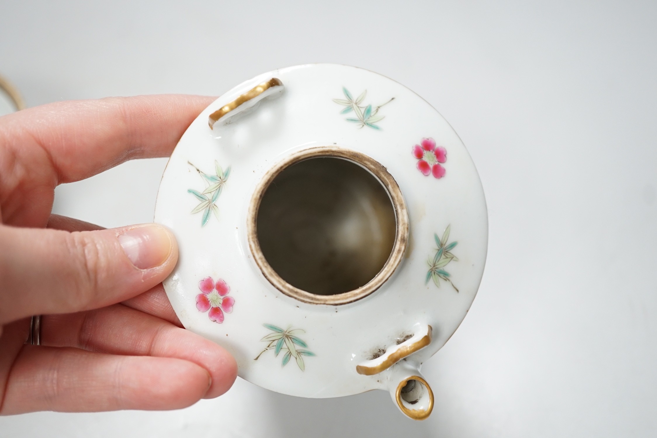 A Chinese famille rose teapot and a cover, together with a similar dish. 12cm tall